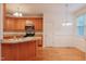 Kitchen features stainless steel appliances and an open concept leading to the dining area at 237 Water Front Ln, Timberlake, NC 27583