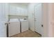 Laundry room featuring a washer, dryer, and cabinets at 237 Water Front Ln, Timberlake, NC 27583