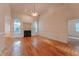 Inviting living room with a cozy fireplace, hardwood floors, and natural light at 237 Water Front Ln, Timberlake, NC 27583