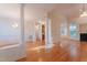 Bright and airy living space with hardwood floors, pillars, and seamless flow to other rooms at 237 Water Front Ln, Timberlake, NC 27583
