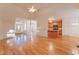 Open living space with hardwood floors seamlessly connecting to the kitchen and entryway at 237 Water Front Ln, Timberlake, NC 27583