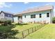 Spacious backyard featuring a well-maintained lawn, a charming patio area, and a secure fence, perfect for outdoor enjoyment at 2635 High Plains Dr, Fuquay Varina, NC 27526