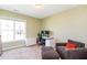 Comfortable bedroom with natural light and cozy carpeting, ideal for rest and relaxation at 2635 High Plains Dr, Fuquay Varina, NC 27526