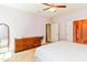 Stylish bedroom featuring a large dresser, fluffy rug, and neutral paint at 2635 High Plains Dr, Fuquay Varina, NC 27526