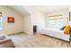 Comfortable bedroom with an accent wall, large windows, and a comfortable sofa at 2635 High Plains Dr, Fuquay Varina, NC 27526