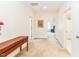 Bright hallway features neutral walls and carpet leading to bedrooms and bathrooms at 2635 High Plains Dr, Fuquay Varina, NC 27526
