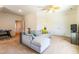 Relaxing living room with plush sectional sofa and a ceiling fan for optimal air circulation at 2635 High Plains Dr, Fuquay Varina, NC 27526