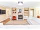 Inviting living room with a cozy fireplace and natural light, perfect for relaxation at 2635 High Plains Dr, Fuquay Varina, NC 27526