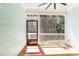 Screened porch offering a serene outdoor space with views of lush greenery at 2635 High Plains Dr, Fuquay Varina, NC 27526