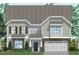 Charming two-story home with a stone-accented garage and inviting entrance at 27 N Maple Walk Dr # 75, Garner, NC 27529