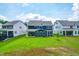 Backyard features green lawn and patio, perfect for outdoor gatherings and enjoying the scenery at 2720 Spotted Coral Ct, Apex, NC 27502