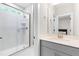 Bathroom featuring marble tile floors, shower, single vanity and doorway to bedroom at 2720 Spotted Coral Ct, Apex, NC 27502
