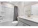 Updated bathroom features a shower-tub combo and a vanity with a gray cabinet at 2720 Spotted Coral Ct, Apex, NC 27502