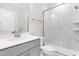Modern bathroom with a glass-enclosed shower and gray vanity at 2720 Spotted Coral Ct, Apex, NC 27502