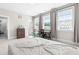 Spacious bedroom featuring large windows and an adjacent ensuite bathroom at 2720 Spotted Coral Ct, Apex, NC 27502