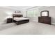Spacious bedroom featuring neutral walls, carpet, a large window and furniture at 2720 Spotted Coral Ct, Apex, NC 27502