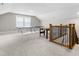 Large bonus room with neutral carpet features games and plenty of space to play at 2720 Spotted Coral Ct, Apex, NC 27502