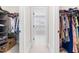 View of walk-in closets with built-in shelving and ample storage space for clothing at 2720 Spotted Coral Ct, Apex, NC 27502