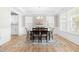 Bright dining room boasts natural light, a stylish chandelier, and elegant decor at 2720 Spotted Coral Ct, Apex, NC 27502