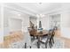 Bright dining room boasts natural light, a stylish chandelier, and elegant decor at 2720 Spotted Coral Ct, Apex, NC 27502