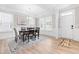 Bright dining room boasts natural light, a stylish chandelier, and elegant decor at 2720 Spotted Coral Ct, Apex, NC 27502