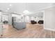 Open floor plan featuring a gray island, stainless appliances and view into a seating area with leather couches at 2720 Spotted Coral Ct, Apex, NC 27502