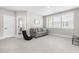 Inviting living room with a cozy sofa, large window, and comfortable seating at 2720 Spotted Coral Ct, Apex, NC 27502