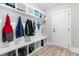 Well-organized mudroom with built-in storage and a door to the outside at 2720 Spotted Coral Ct, Apex, NC 27502