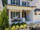 Inviting front porch featuring comfortable seating and stylish decorative columns at 3057 Eden Harbor Ct, Raleigh, NC 27613