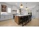 Spacious kitchen with a large island, pendant lighting, and modern appliances at 3057 Eden Harbor Ct, Raleigh, NC 27613