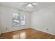 Sunlit bedroom featuring hardwood floors and a ceiling fan at 311 Westbrook Dr, Carrboro, NC 27510
