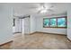 Spacious bedroom with a ceiling fan, barn door to a bathroom, and windows that provide natural light at 311 Westbrook Dr, Carrboro, NC 27510