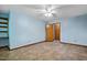 Large bedroom with blue walls and a built-in shelf, offers generous space and natural light at 311 Westbrook Dr, Carrboro, NC 27510