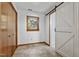 Well-lit bedroom with a barn door to the bathroom and an updated closet with modern hardware at 311 Westbrook Dr, Carrboro, NC 27510