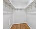 Empty closet features white shelving and hardwood flooring, ready for organization at 311 Westbrook Dr, Carrboro, NC 27510