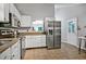 Kitchen featuring stainless steel appliances, granite countertops, and ample natural light at 311 Westbrook Dr, Carrboro, NC 27510
