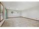 Empty living room with tile flooring, large windows, and natural lighting at 311 Westbrook Dr, Carrboro, NC 27510