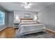 Spacious main bedroom features a king bed, hardwood floors, and bright neutral paint at 311 Westbrook Dr, Carrboro, NC 27510