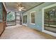 Relaxing screened-in porch with a ceiling fan and a view of the wooded backyard at 311 Westbrook Dr, Carrboro, NC 27510