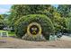 Entrance sign for The Chapel Hill Tennis Club, set against a backdrop of lush greenery at 311 Westbrook Dr, Carrboro, NC 27510