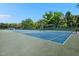 A view of the community tennis courts, showing well-maintained blue and green surfaces ready for play at 311 Westbrook Dr, Carrboro, NC 27510
