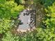 An aerial view of the home's roof surrounded by lush trees at 3218 Seven Springs Rd, Hillsborough, NC 27278