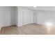 Large bedroom featuring hardwood floors, closet, and natural lighting at 3218 Seven Springs Rd, Hillsborough, NC 27278