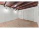 Bedroom with wood beam ceiling, hardwood floors and closet at 3218 Seven Springs Rd, Hillsborough, NC 27278