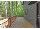 Spacious deck overlooks a serene wooded area, perfect for outdoor living and relaxation at 3218 Seven Springs Rd, Hillsborough, NC 27278