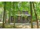 A charming home nestled among mature trees, offering a sense of privacy and connection with nature at 3218 Seven Springs Rd, Hillsborough, NC 27278