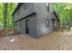 Rear view of a home featuring a large deck, providing an ideal space for outdoor entertaining at 3218 Seven Springs Rd, Hillsborough, NC 27278