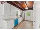 Bright kitchen with white cabinets, stainless steel appliances, and wood flooring at 3218 Seven Springs Rd, Hillsborough, NC 27278