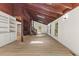 Bright living room with hardwood floors, recessed lighting, and exposed wood beams at 3218 Seven Springs Rd, Hillsborough, NC 27278