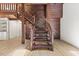 Cozy living room featuring a staircase and hardwood floors, creating a warm ambiance at 3218 Seven Springs Rd, Hillsborough, NC 27278